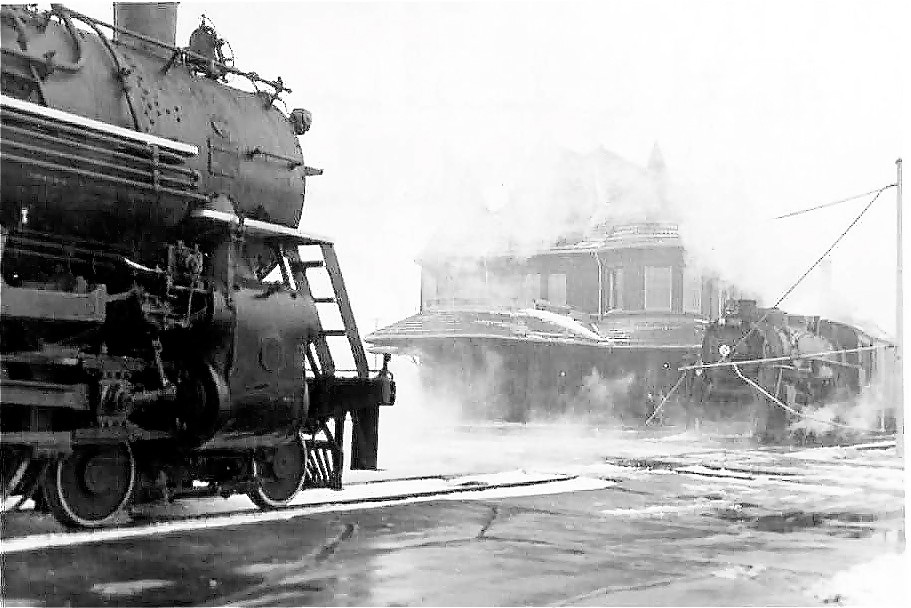 Trains pass at Durand at gated crossing